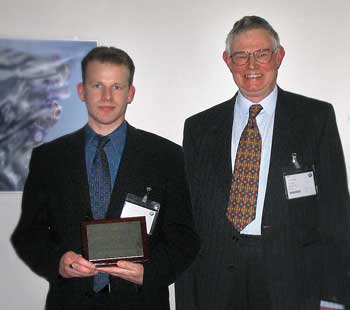 Adrain Ochard being presented with his Prize